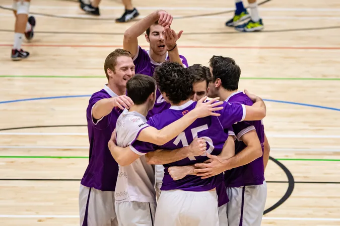 Durham University team having a huddle on court during a match