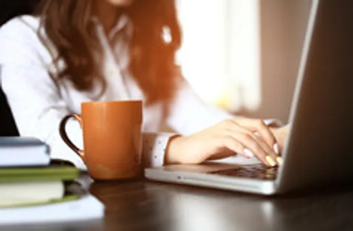 Female hands on laptop