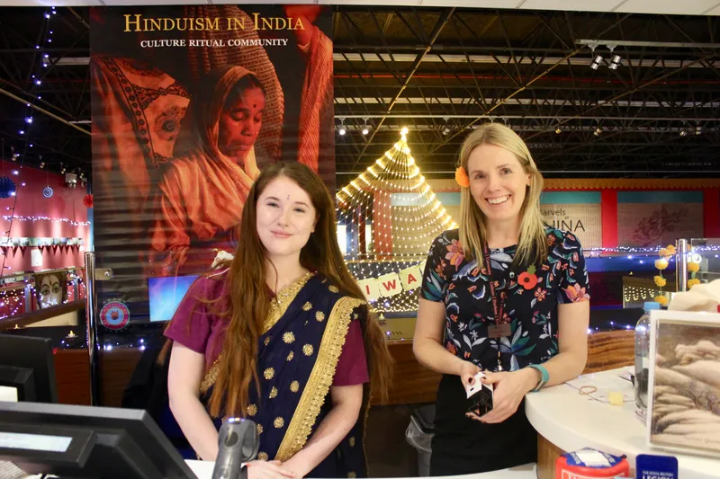 Museum staff welcoming guests to the museum