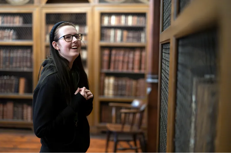 Student in Cosin's library looking at the resources